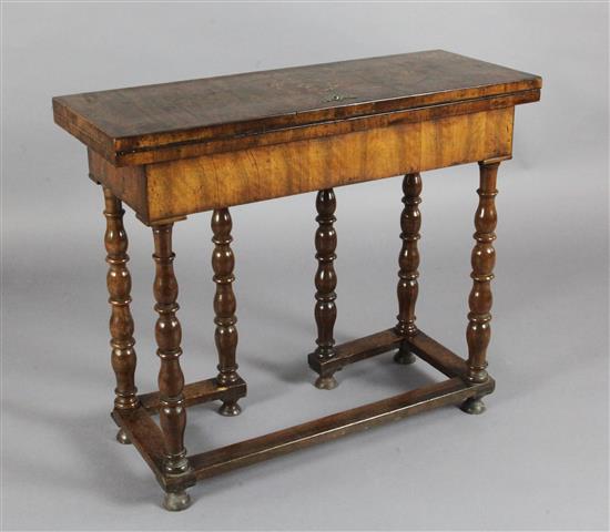 An early 18th century marquetry inlaid walnut side table, W.2ft 10in. D.1ft 1in. H.2ft 4in.